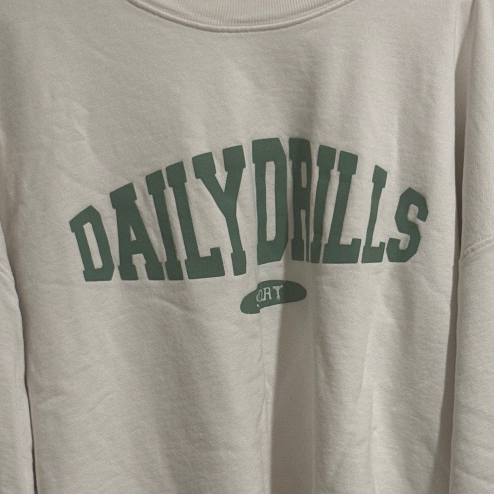 Daily Drills White Top with Green Label